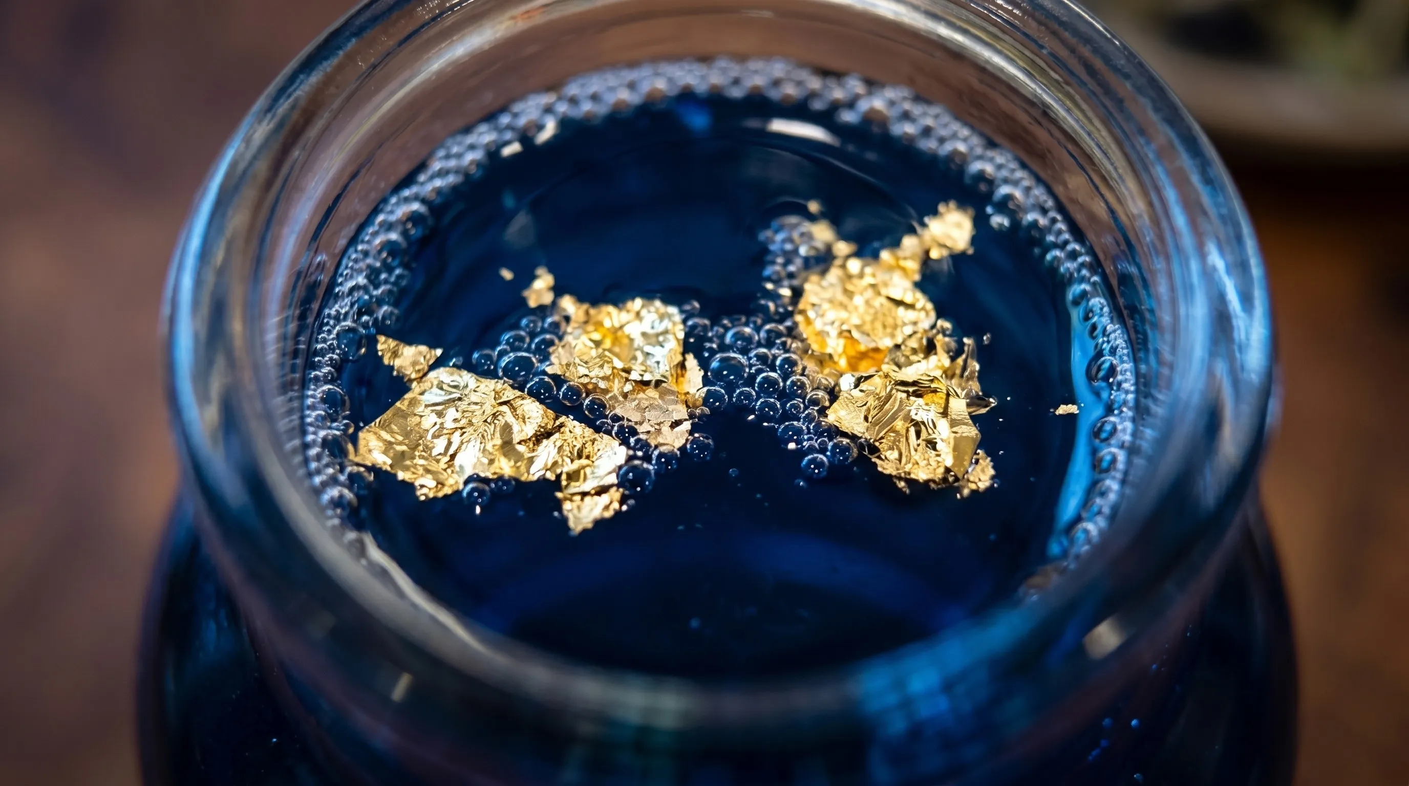 Gold flakes suspended in the blue — the golden carrot, translated